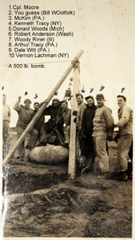 Personnel of a US Army bomb disposal unit with a 500-pound bomb, France, May 1945; left to right: Cpl Moore, Bill Woolfolk, McKim, Kenneth Tracy, Donald Woods, Robert Anderson, Woody Riner, Arthur Tracy, Dale Witt, Vernon Lachman