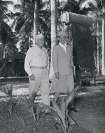 United States Navy Vice Admiral Aubrey Fitch walking with Eleanor Roosevelt during the first lady’s tour of the South Pacific on behalf of the Red Cross, 14 Sep 1943, Espiritu Santo, New Hebrides.