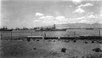 Cruiser USS Chester at Pearl Harbor, Hawaii, 1936. Note six battleships on Battleship Row and cruisers Minneapolis and New Orleans (New Orleans-class) at left. Note also the passenger train cars in the foreground.