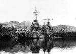 USS New Orleans making repairs under make-shift camouflage in Tulagi Harbor, Solomon Islands, 1 Dec 1942. New Orleans was struck by a torpedo in the Battle of Tassafaronga that blew off 150 feet of her bow.