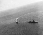 Cruiser USS Northampton making preparations to take the stricken USS Hornet (Yorktown-class) under tow, Battle of Santa Cruz Islands, 26 Oct 1942. Note destroyer USS Russell alongside Hornet