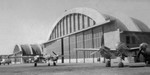 P-38 Lightning fighters in front of the hangars at Borinquen Field, Puerto Rico while in transit to the European Theater, 1943. Note also an OA-10 Catalina (the USAAF designation for the PBY) at extreme left.