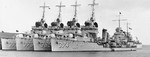 Sister Mahan-class destroyers USS Case, USS Shaw, USS Cummings, and USS Tucker nested together at Auckland, New Zealand, Mar 1941. Note cruiser USS Brooklyn coming in behind the destroyers.