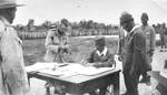 Australian General Sir Thomas Blamey witnessing Japanese Second Army Lt General Fusataro Teshima signing the instrument of surrender for Japanese forces throughout the Dutch East Indies, Morotai, 9 Sep 1945. Photo 2 of 2