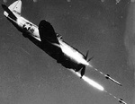 Republic P-47D Thunderbolt 44-90386 firing HVAR air-to-surface rockets at a test range in Independence, Missouri, United States, circa 1945.