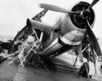 TBM Avenger heavily lashed to the deck of escort carrier USS Anzio as the ship rocks with Typhoon Cobra in the Philippine Sea, 17 Dec 1944.