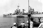 A PT motor torpedo boat alongside USS Nashville off Tacaloban, Leyte, 25 Oct 1944 to take General MacArthur and his staff ashore to establish Army headquarters on Leyte. Nashville then departed for the Surigao Strait.