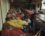 WAAF personnel repairing and packing parachutes at an RAF glider station, Britain, 31 May 1944