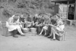 RAF personnel and Norwegian civilians peeling potatoes at an RAF station of 88 Group, Oslo, Norway, 1945