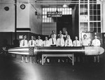 Department heads at the United States Navy’s Naval Torpedo Station, Alexandria, Virginia posing with the last Mark XIV torpedo produced at the facility, Aug 1945.