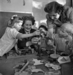 WAAF members who were training to become instructors of the RAF Educational and Vocational Training Scheme visiting a children