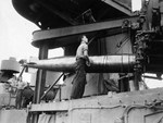 Mark XV torpedoes being transferred to the USS Nicholas from the USS Patterson at Tulagi, Solomon Islands, 14 Jul 1943 following the Battle of Kolombangara. Photo 2 of 2.