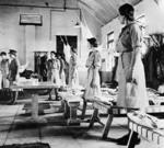 WAAF recruits standing by their beds during a kit inspection, Egypt, date unknown