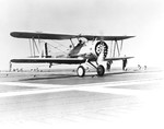 First aircraft landing aboard carrier USS Ranger, 21 Jun 1934. The pilot was Lieutenant Commander Arthur Davis flying a Vought O3U-3 Corsair scout plane.