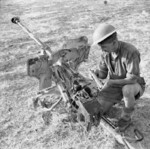 British soldier studying a captured 28cm sPzB 41 anti-tank gun, Sicily, Italy, 21 Jul 1943