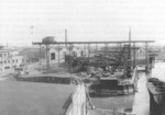 Unterweser shipyard, Bremerhaven, Germany, 1933; note administrative building on the left and shipbuilding hall and the forge in the background