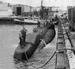 USS S-38 at San Diego, California, United States, Apr 1943; note tug boat YMT-3 in background