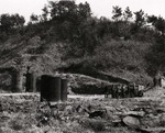 Men of the United States Army 1st Cavalry Division examining the freshly discovered launch site for the Fu-Go balloon bombs at Otsu, Japan Apr 1947. The dark barrel-shaped devices are gas generators for the hydrogen gas.