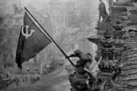 Red Army soldier Mikhail Alekseevich Yegorov of Soviet 756 Rifle Regiment flying the Soviet flag over the Reichstag, Berlin, Germany, 2 May 1945, photo 2 of 3