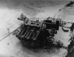 Wrecked Mikazuki being inspected by USMC personnel, off Cape Gloucester, New Britain, 8 Feb 1944; note triple mounting for 25mm anti-aircraft machine guns (guns removed) on the after deckhouse