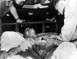 Hideki Tojo receiving medical treatment after his failed suicide attempt, Japan, 11 Sep 1945