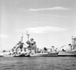 French frigate Le Brestois (foreground), battleship Jean Bart (center), and training hulk Océan (former heavy cruiser Suffern) at Toulon, France, circa 1963