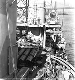 Midship section of Fletcher-class destroyer USS Saufley at Brooklyn Navy Yard, Brooklyn, New York, 22 Sep 1942. Note the two large searchlights on the after funnel and the torpedo tubes between the funnels.