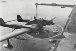 BV 138 MS Seedrache minesweeping aircraft being lifted onto a seaplane tender, 1940s; note degaussing ring