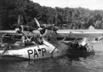 Australian troops of 37/52nd infantry battalion loading gear onto a New Zealand PB2B-1 Catalina aircraft at Nantambu, New Britain, Solomon Islands, 22 Aug 1945