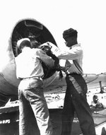 Mechanics working on a PBY Catalina engine at Naval Air Station, Seattle, Washington, 26-27 Apr 1944