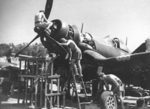 F4U-1 Corsair fighter of No. 16 Squadron Royal New Zealand Air Force being serviced at Green Island (now Nissan Island), 21 Dec 1944