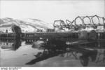 German Do 24 aircraft at Narvik, Norway, Apr 1940; note damaged buildings in background