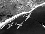 Canadian Hurricane fighters in flight over shore lines, date unknown