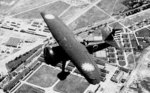 Chinese Air Force I-15bis fighter in flight above the Jianqiao Central Aviation School, Hangzhou, Zhejiang, China, circa 1930s