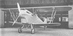 Ki-10-I aircraft at rest near a hangar, Japan, 1930s