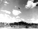 12 Liberator bombers flew in four V formations over the Japanese surrender ceremony at Okinawa, Japan, 7 Sep 1945; note Japanese guns in center and M26 Pershing tanks in left corner