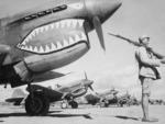 Chinese soldier guarding P-40 Warhawk fighters of the AVG 