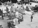 At the Commonwealth Aircraft Corporation factory in Australia, employees move a partly constructed Wirraway aircraft to a more advanced position in the assembly line, 2 Feb 1940