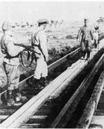 A Japanese soldier surrendering to Soviets, northeastern China, Aug 1945