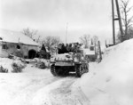 Men of Company I, 3d Battalion, 16th Infantry Regiment, US 1st Division riding on M4 Sherman tank at Schopen, Belgium, 21 Jan 1945