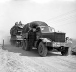 British Diamond T Model 980 tractor towing a trailer loaded with a Churchill tank during preparations for crossing the Rhine River into Germany, 23 Mar 1945