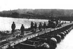 Men of B Company of US 150th Combat Engineer Battalion building the first bridge across the Rhine River, Germany, 23 Mar 1945