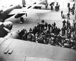 Armorers preparing the Doolittle Raid bombers aboard USS Hornet, 18 Apr 1942, photo 1 of 3