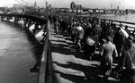 German prisoners of war marching across a bridge after being captured by the Soviets, Königsberg, Germany (now Kaliningrad, Russia), Apr 1945