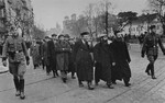 Polish Jews being gathered by German police as forced laborers, near St. Anne