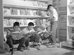 Japanese-American boys reading comic books in Tule Lake Relocation Center, Newell, California, United States, 1 Jul 1942