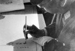 Hiroshi Nemoto signing the surrender document at the Forbidden City, Beiping, China, 10 Oct 1945, photo 3 of 3