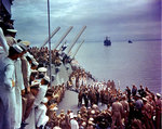 Admiral Conrad E. L. Helfrich signing the Japanese surrender document on behalf of the Netherlands aboard USS Missouri, 2 Sep 1945; note MacArthur next to Helfrich. Photo 1 of 2.