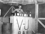 US Marine celebrating victory over Japan at Guam, 1945