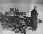 US Navy Chaplain O. David Herrmann preparing to hold religious service for US Marines on Saipan, Mariana Islands, 24 Jun 1944; note wrecked Type 95 Ha-Go light tank used as altar